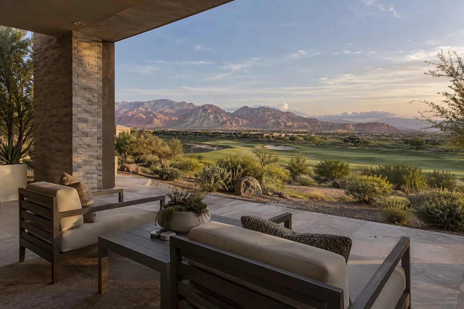 Shaded patio of a Summerlin home overlooking a golf course and Red Rock Canyon